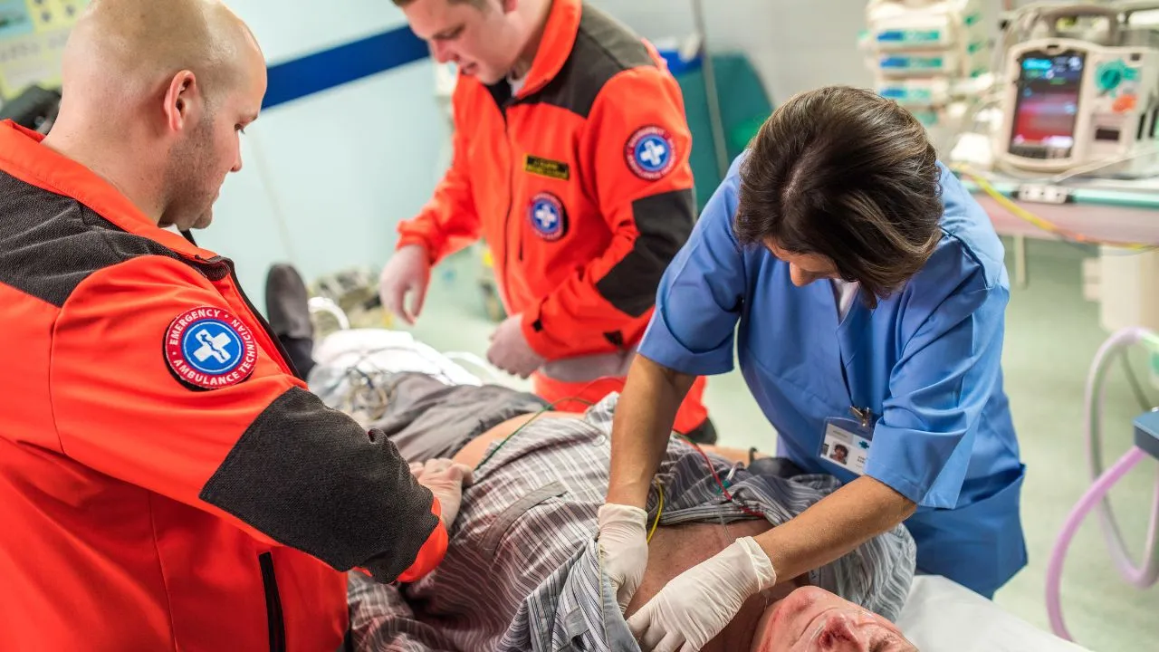 nurses and paramedics working together to help a patient
